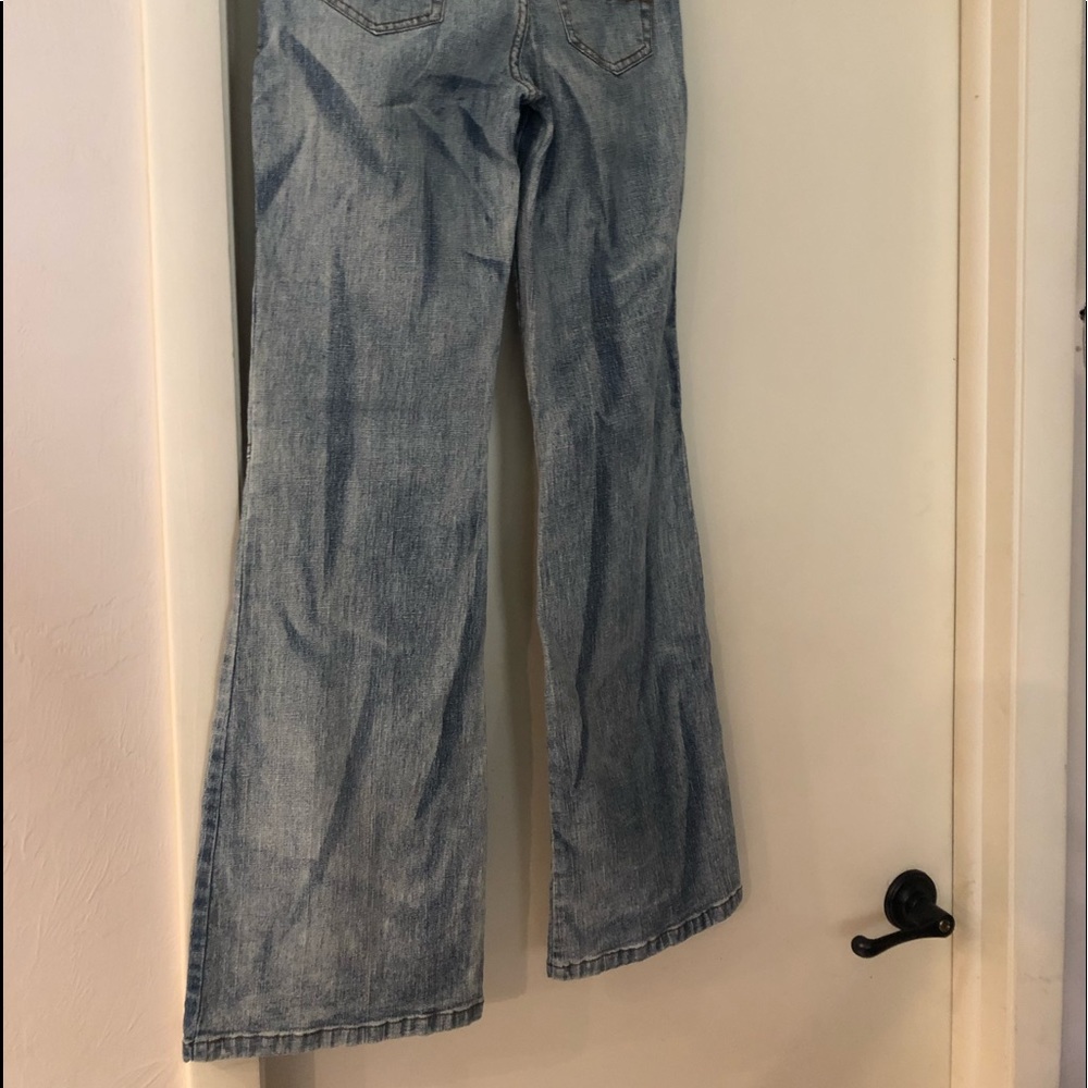 Flare Jeans with lace inlet on bottom.